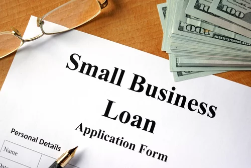 Small business loan form on a wooden table