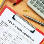 Business concept meaning SBA 504 Loan Agreement with sign on the bank form