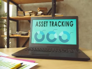 Laptop with asset tracking data on the screen