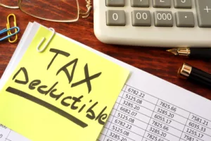 Sticker with title tax deductible and financial documents