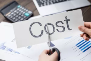 the word cost on on a piece of paper cost savings concept